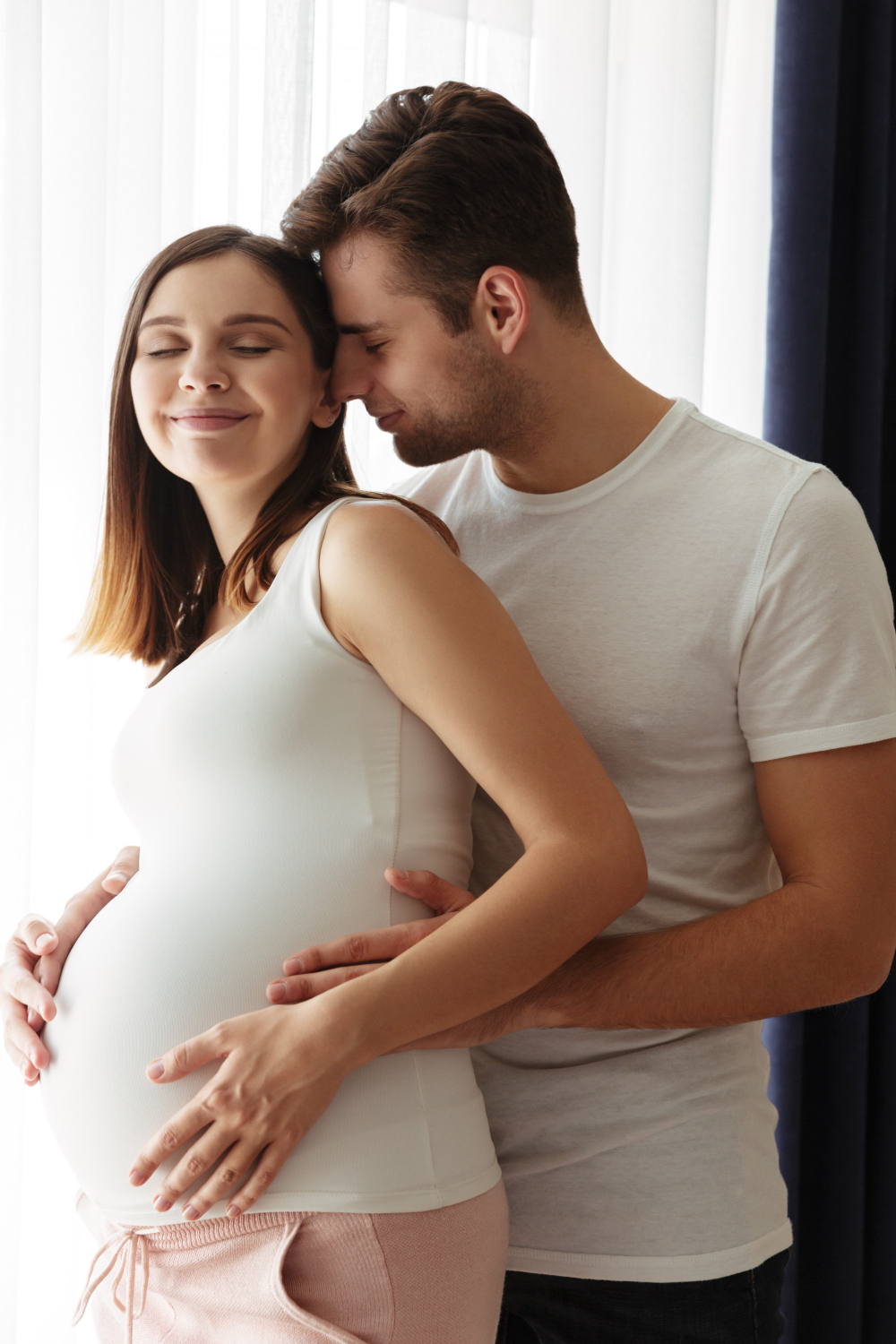 happy-handsome-man-hug-his-lovely-pregnant-wife